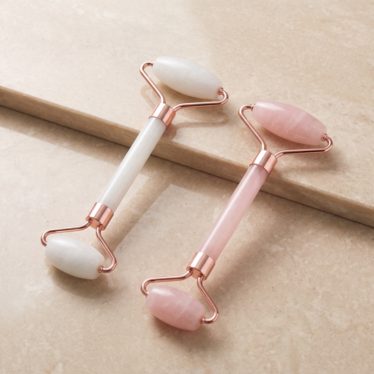 The Sculpt Duo contour roller and scraping tool laid side by side