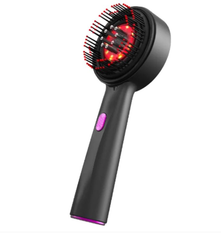 The Scalp Comb held in one hand, showing its rounded teeth
