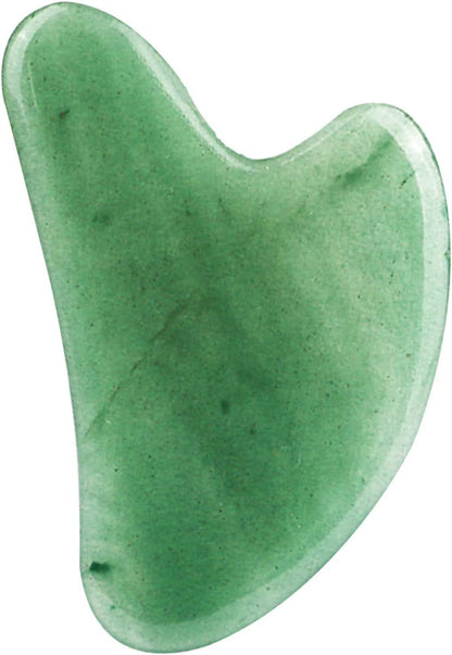 The jade gua sha stone, showing its curved contouring edge