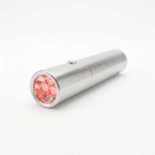 The Glow Wand handheld red light device with its LEDs lit